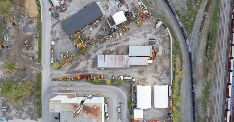 Drone photo of an active construction site in Québec City, showcasing equipment and layout.