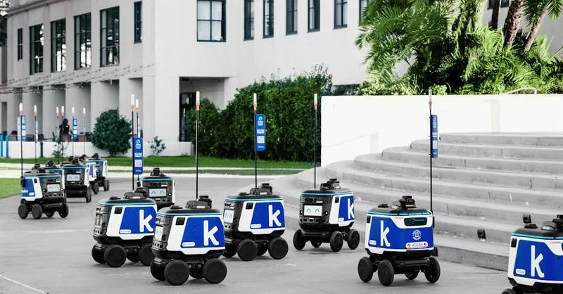 Futuristic autonomous robots delivering packages in an urban setting, showcasing modern technology.